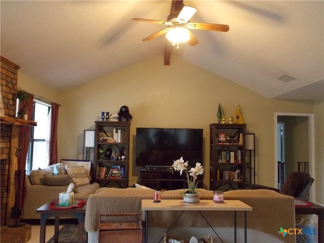 living area with visible vents, a ceiling fan, and lofted ceiling