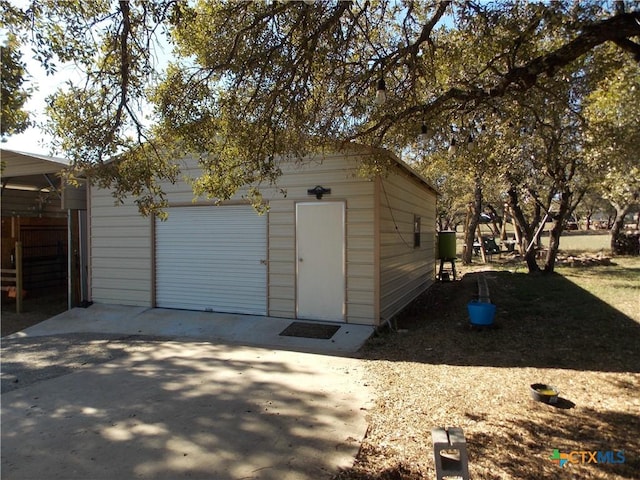 view of outdoor structure with a garage