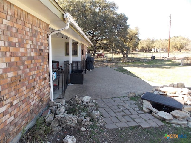 view of patio with fence