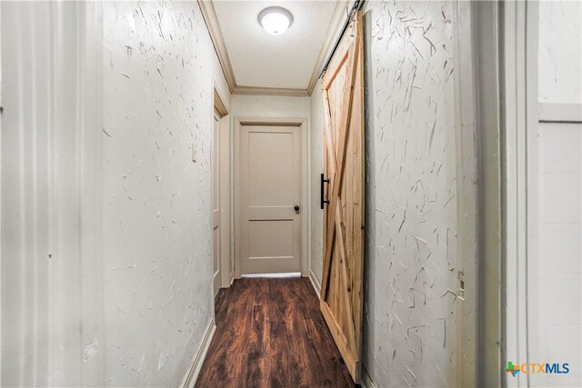704 Maple St, Yoakum, TX 77995 - hall with dark wood finished floors, a textured wall, and crown molding