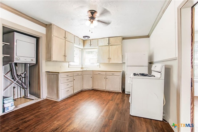 704 Maple St, Yoakum, TX 77995 - kitchen with gas range gas stove, light brown cabinetry, dark wood-style floors, ornamental molding, and ceiling fan