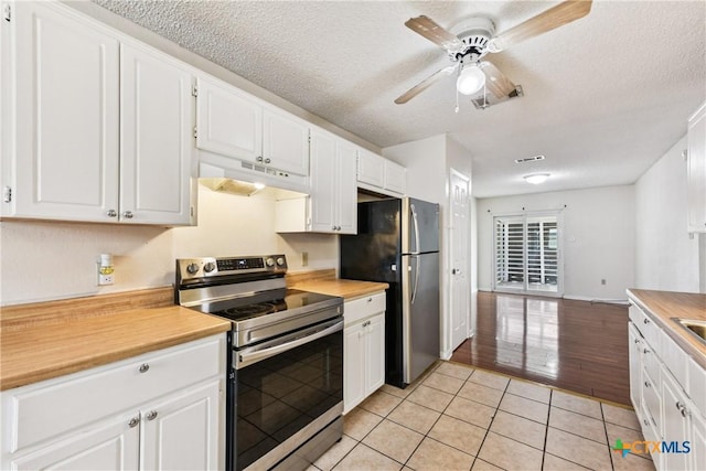 2601 Traverse Dr, Killeen, TX 76543 - kitchen featuring stainless steel appliances, under cabinet range hood, light tile patterned floors, ceiling fan, and light countertops