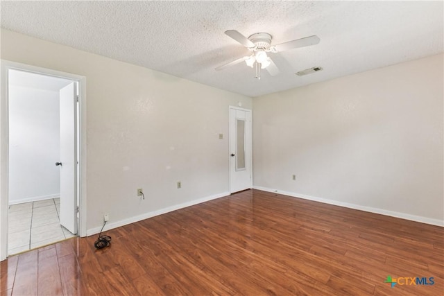 2601 Traverse Dr, Killeen, TX 76543 - unfurnished room with a ceiling fan, wood finished floors, and a textured ceiling