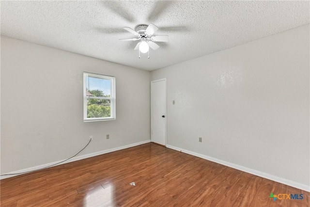 2601 Traverse Dr, Killeen, TX 76543 - spare room featuring wood finished floors, a ceiling fan, and a textured ceiling