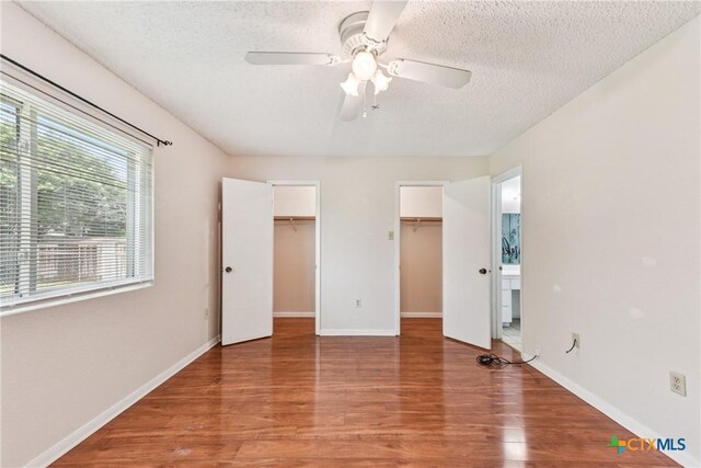2601 Traverse Dr, Killeen, TX 76543 - unfurnished bedroom with light wood-style floors, a textured ceiling, and ceiling fan