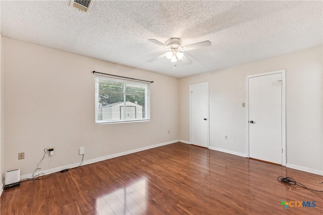 2601 Traverse Dr, Killeen, TX 76543 - unfurnished bedroom featuring wood finished floors, a textured ceiling, and ceiling fan