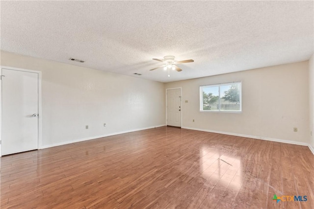 2601 Traverse Dr, Killeen, TX 76543 - spare room featuring a ceiling fan, wood finished floors, and a textured ceiling