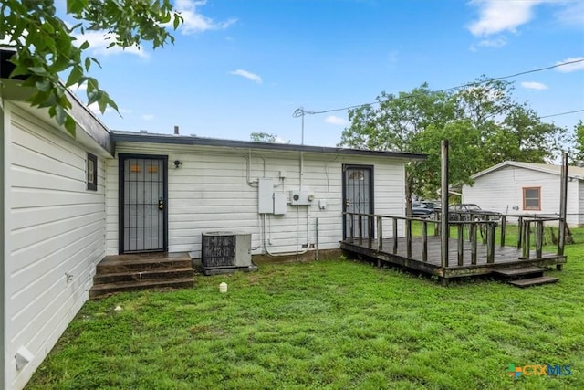 1102 S 5th St, Copperas Cove, TX 76522 - rear view of house featuring a lawn and a wooden deck