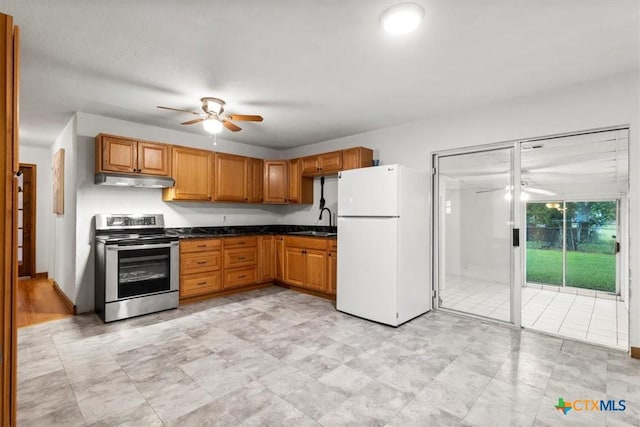 1102 S 5th St, Copperas Cove, TX 76522 - kitchen featuring freestanding refrigerator, stainless steel electric stove, a ceiling fan, and dark countertops