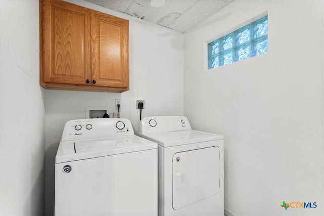 1102 S 5th St, Copperas Cove, TX 76522 - washroom with cabinet space and washing machine and clothes dryer