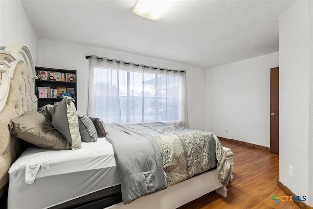 1102 S 5th St, Copperas Cove, TX 76522 - bedroom with wood finished floors and baseboards