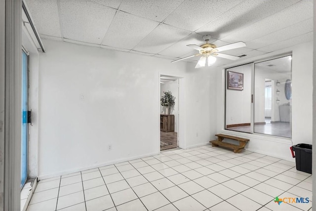 1102 S 5th St, Copperas Cove, TX 76522 - empty room featuring a ceiling fan, a drop ceiling, and healthy amount of natural light