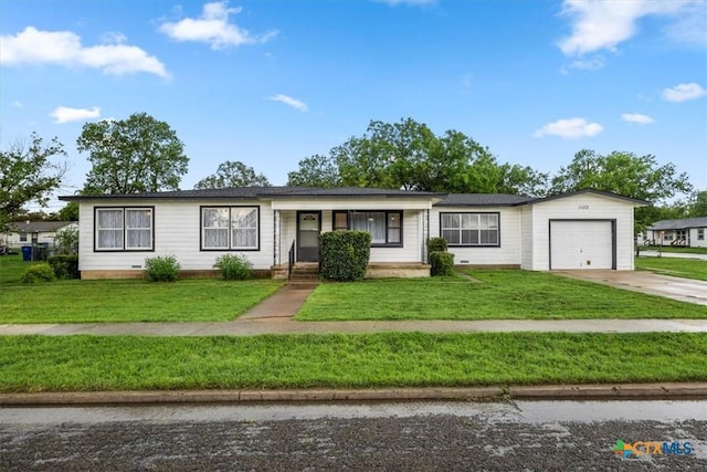 1102 S 5th St, Copperas Cove, TX 76522 - single story home with concrete driveway, an attached garage, a front lawn, and covered porch