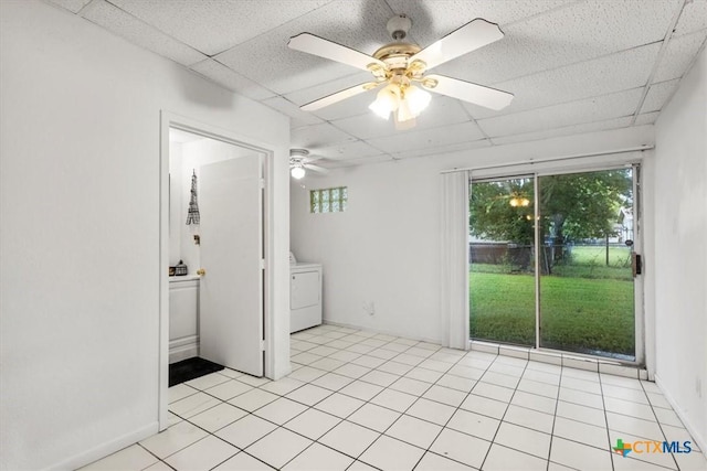 1102 S 5th St, Copperas Cove, TX 76522 - unfurnished bedroom with washer / clothes dryer, access to outside, a drop ceiling, a ceiling fan, and light tile patterned floors