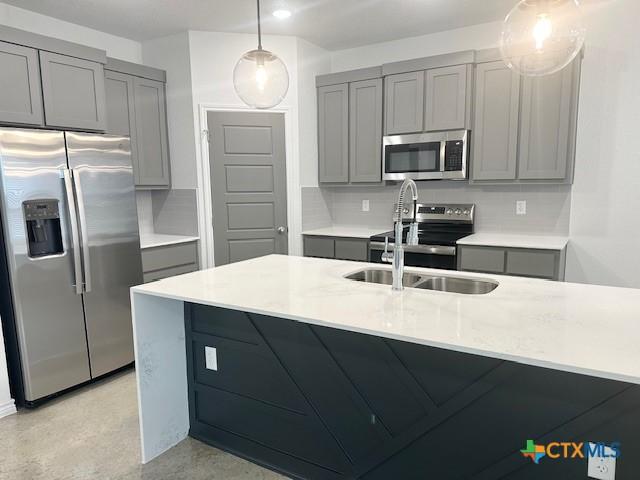 kitchen featuring backsplash and gray cabinets