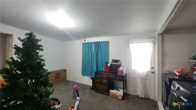 miscellaneous room with carpet floors and washing machine and clothes dryer