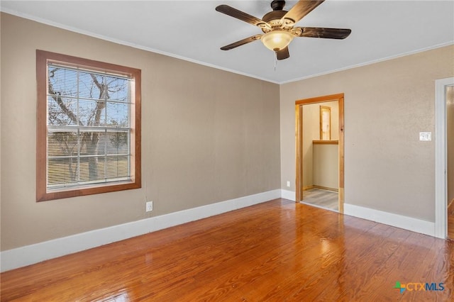 unfurnished bedroom with ceiling fan, wood-type flooring, and ornamental molding