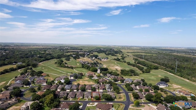 drone / aerial view with a residential view and golf course view