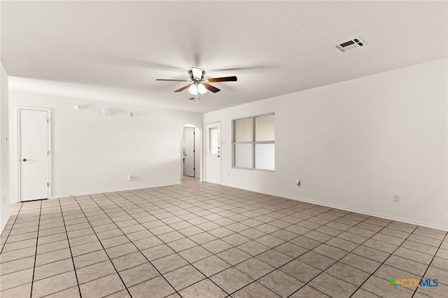 3908 Fieldcrest Dr, Killeen, TX 76549 - spare room with a ceiling fan, arched walkways, and light tile patterned flooring