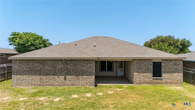 3908 Fieldcrest Dr, Killeen, TX 76549 - back of house featuring a patio, brick siding, and a shingled roof