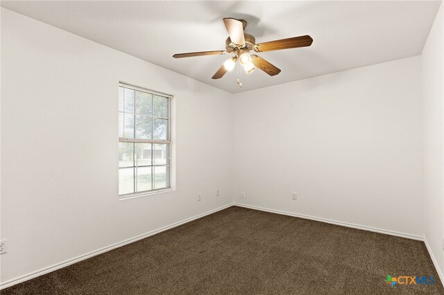 3908 Fieldcrest Dr, Killeen, TX 76549 - unfurnished room featuring dark carpet and a ceiling fan