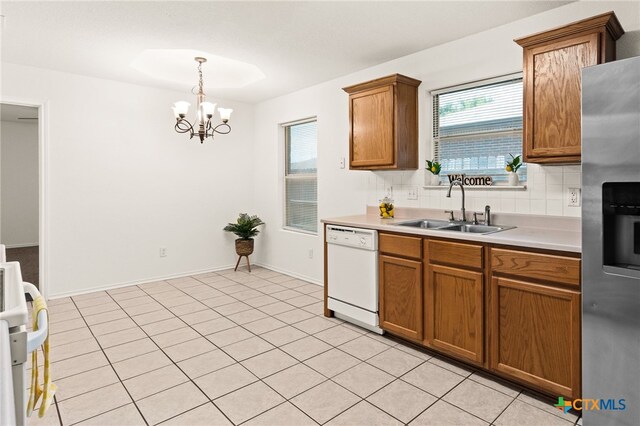 3908 Fieldcrest Dr, Killeen, TX 76549 - kitchen with dishwasher, stainless steel fridge, plenty of natural light, and brown cabinetry