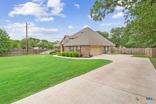 3306 Spring Canyon Rd, Belton, TX 76513 - view of side of home with fence, an attached garage, brick siding, concrete driveway, and a yard