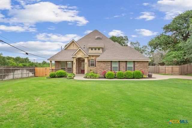 3306 Spring Canyon Rd, Belton, TX 76513 - craftsman-style home with brick siding, fence, and a front lawn