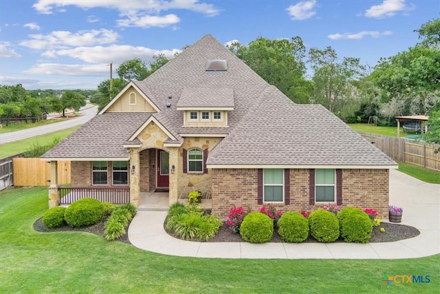 3306 Spring Canyon Rd, Belton, TX 76513 - craftsman inspired home with fence, brick siding, roof with shingles, and a front yard