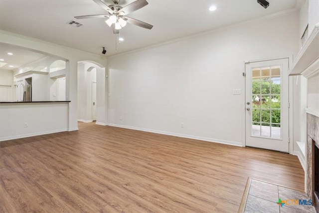 3306 Spring Canyon Rd, Belton, TX 76513 - unfurnished living room featuring ceiling fan, crown molding, a fireplace, light wood-type flooring, and recessed lighting