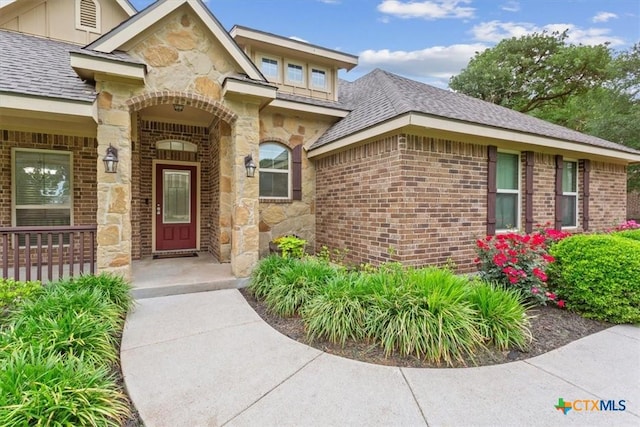 3306 Spring Canyon Rd, Belton, TX 76513 - property entrance featuring roof with shingles, board and batten siding, brick siding, and stone siding