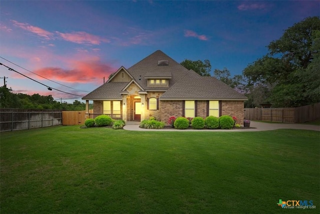 3306 Spring Canyon Rd, Belton, TX 76513 - craftsman-style home with brick siding, a fenced backyard, and a front lawn