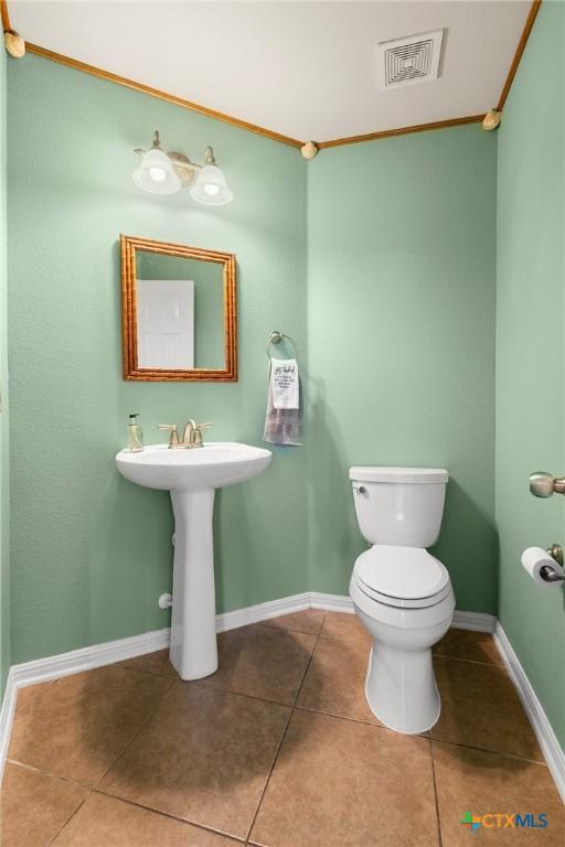 101 Payne Stewart Dr, Round Rock, TX 78664 - bathroom with tile patterned floors and crown molding