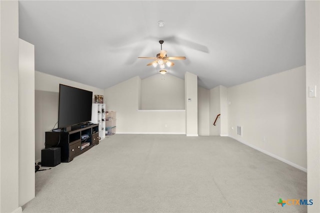 101 Payne Stewart Dr, Round Rock, TX 78664 - unfurnished living room featuring a ceiling fan, vaulted ceiling, and carpet floors