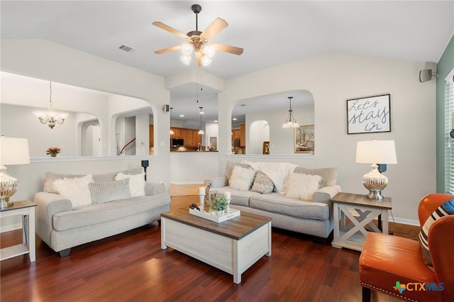101 Payne Stewart Dr, Round Rock, TX 78664 - living room with lofted ceiling, arched walkways, dark wood finished floors, a ceiling fan, and a chandelier
