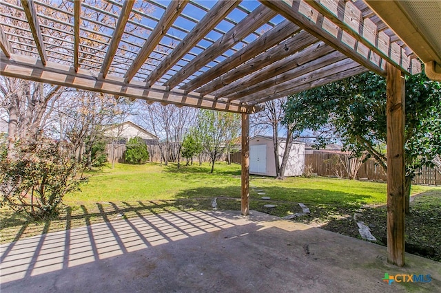 view of patio / terrace with a shed and a pergola