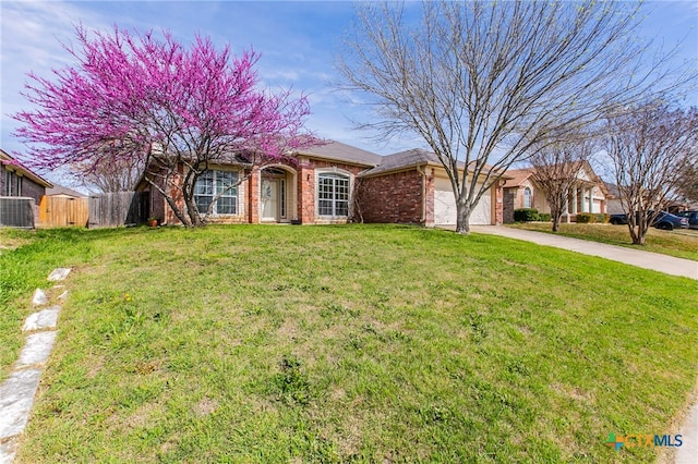 view of front of home with a garage and a front yard