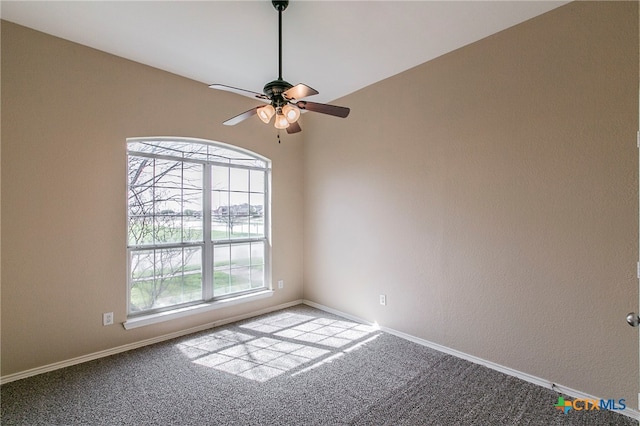 carpeted empty room featuring ceiling fan