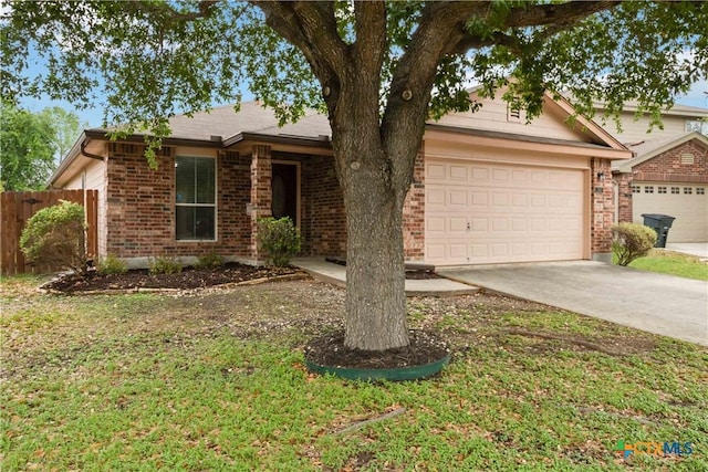ranch-style house featuring a front yard, a garage, driveway, brick siding, and fence