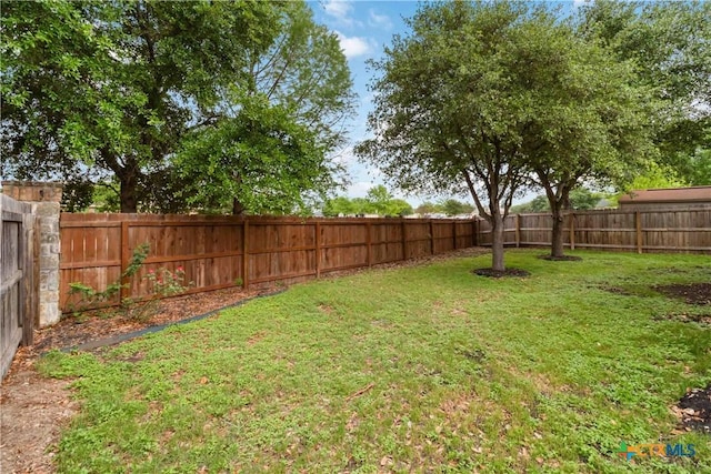 view of yard featuring a fenced backyard