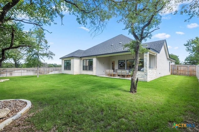 813 Eagle Heights Dr, Salado, TX 76571 - back of property with a shingled roof, a patio area, stone siding, and board and batten siding