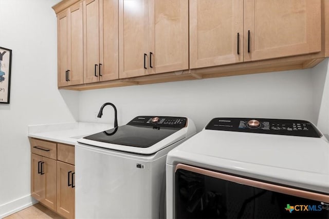 813 Eagle Heights Dr, Salado, TX 76571 - laundry area featuring cabinet space, washing machine and clothes dryer, and baseboards