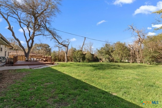 view of yard featuring a deck