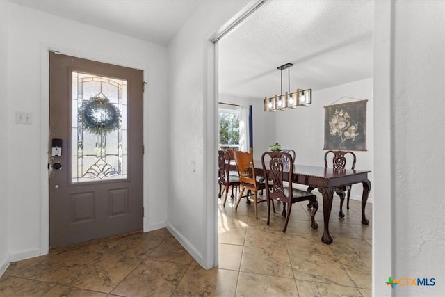 entrance foyer featuring baseboards