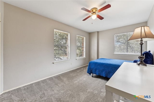 carpeted bedroom with ceiling fan