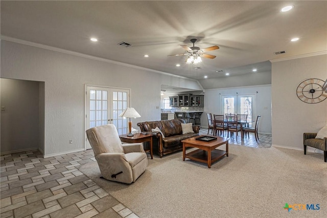 living room with ornamental molding, french doors, ceiling fan, and carpet