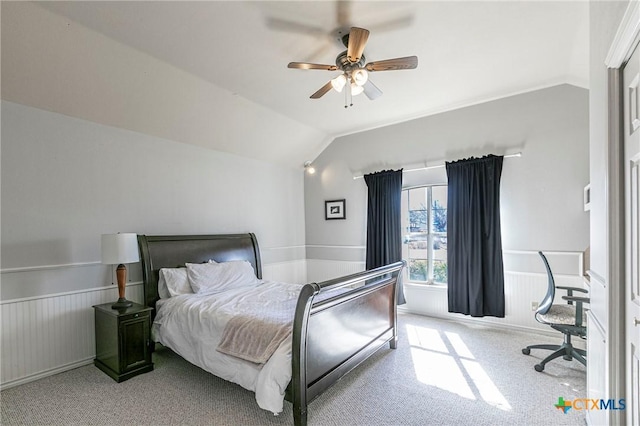 carpeted bedroom with lofted ceiling and ceiling fan