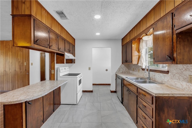 kitchen featuring sink, tasteful backsplash, white range oven, stainless steel dishwasher, and wooden walls