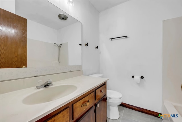 bathroom with vanity, tile patterned flooring, and toilet