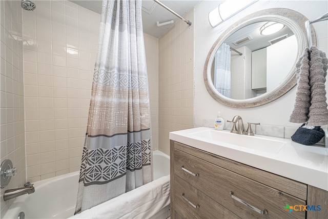 bathroom featuring vanity and shower / tub combo with curtain